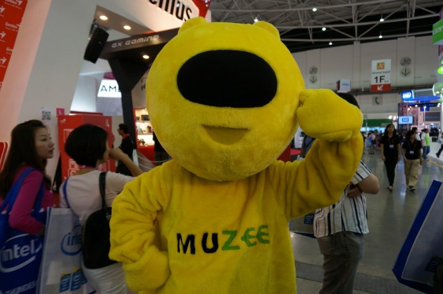 O mascote da Muzee.