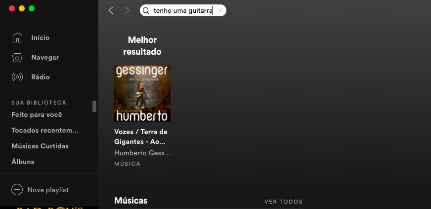 Tela do Spotify com "tenho uma guitarra" digitado na busca e "Vozes / Terra de Gigantes" de Humberto Gessinger aparecendo nos resultados.