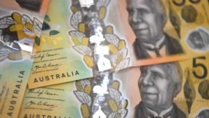 Dólar australiano. Imagem: William West (Getty Images)