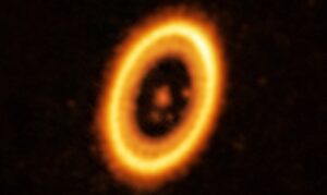 imagem do sistema planetário PDS70, com estrela no centro, planeta e nuvem de detritos